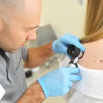 dermatologist-examines-neoplasms-on-the-patient-s-2025-01-08-17-31-40-utc-jpg.webp.webp