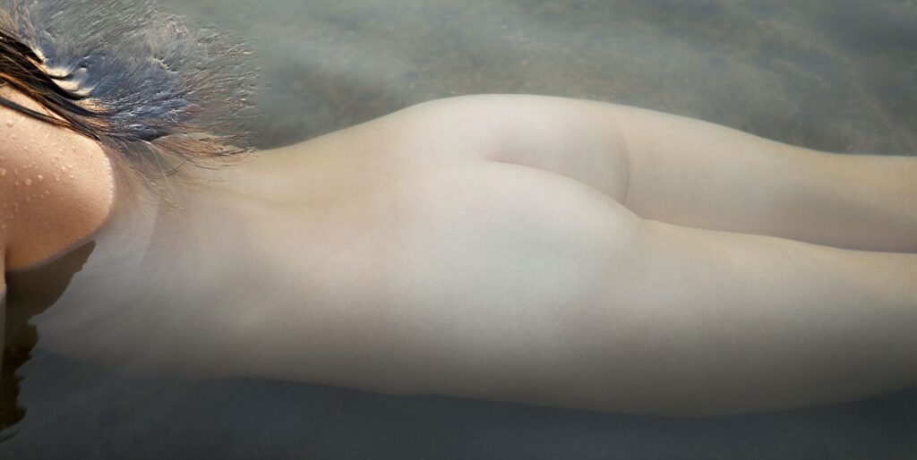 naked-womans-mid-section-under-water-back-view-royalty-free-image-1746614053.pjpeg_.jpeg