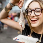 woman-with-dutch-herring-2025-03-13-07-10-48-utc-jpg.webp.webp